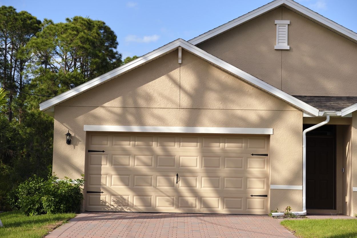 wide garage double door and concrete driveway of new modern american house