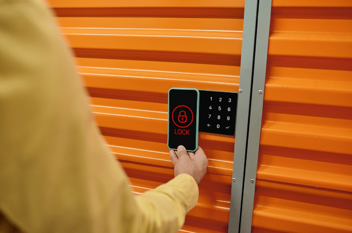 Secure garage door with mobile phone unlocking tool