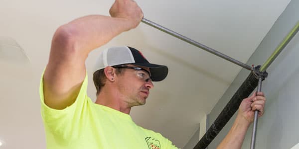 Technician performing garage door service