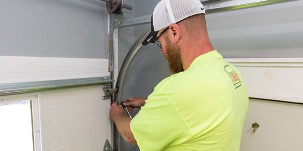 Technician performing garage door service