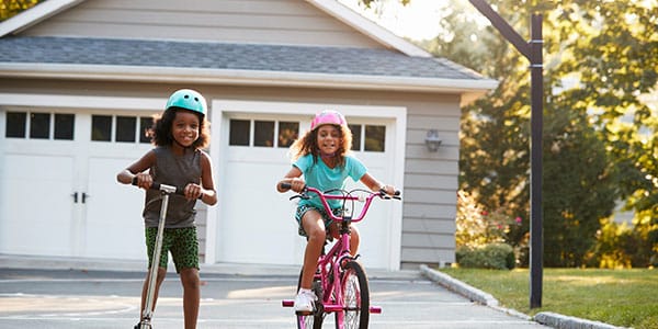 Kids playing in front of house