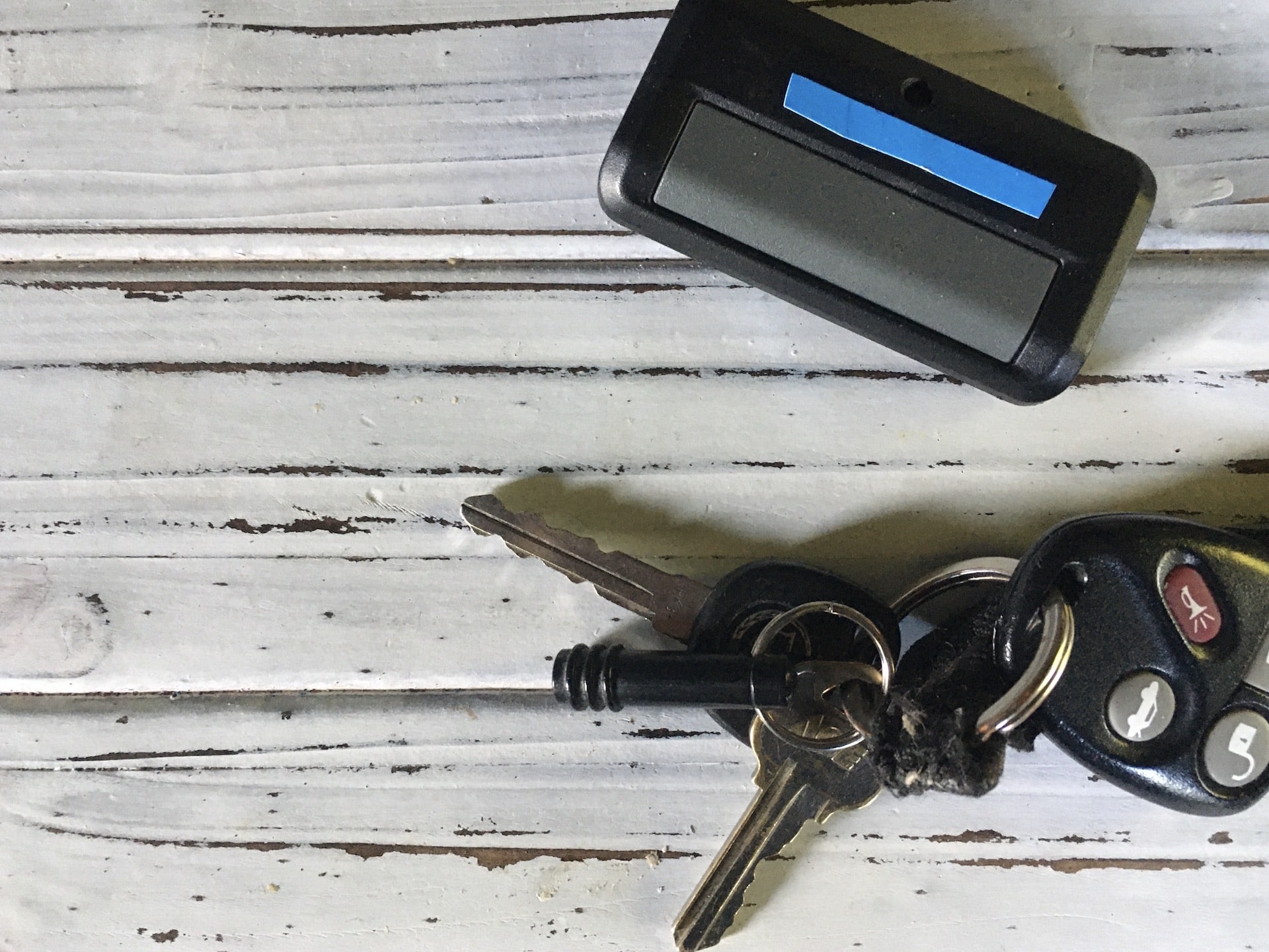 keys and garage door opener on white background 2021 08 31 01 52 19 utc