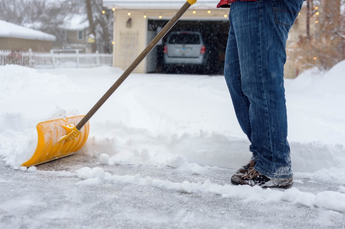 man shoveling driveway