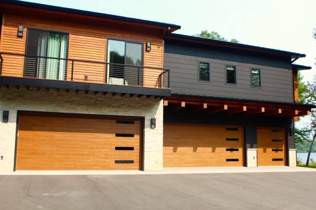 Clopay Canyon Ridge Modern Medium Oak Cypress Plank with Slim Windows In Each Section