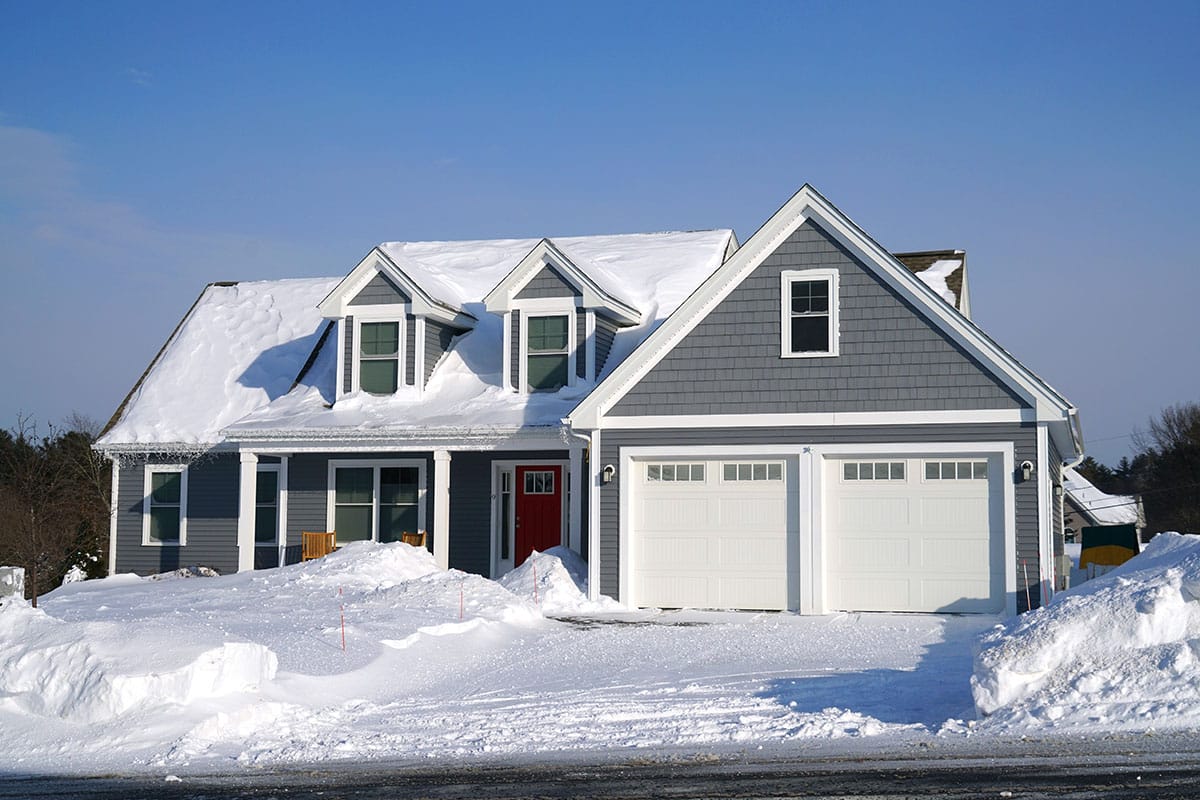 Winter house front view after snow storm