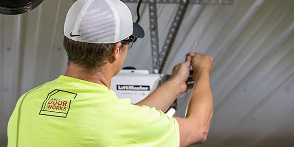 Technician performing garage door service